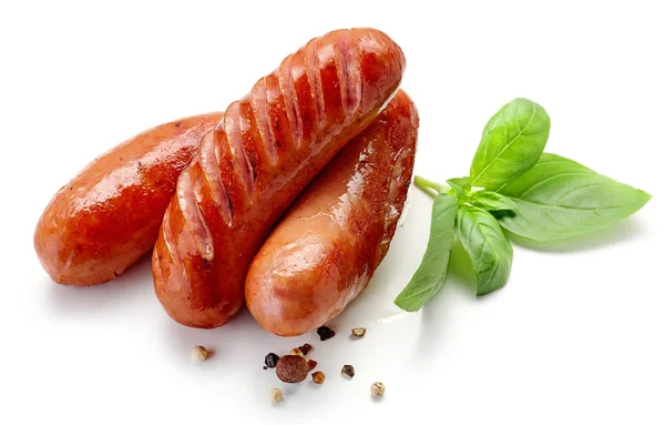 Grilled sausages on white background — Stock Photo, Image