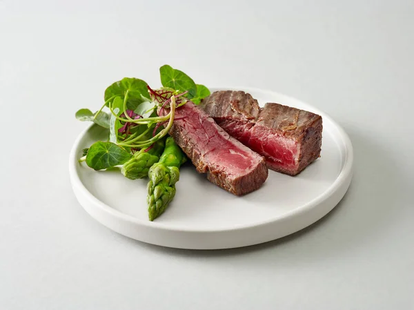 Plate of beef wagyu steak meat with herbs and asparagus — Stock Photo, Image
