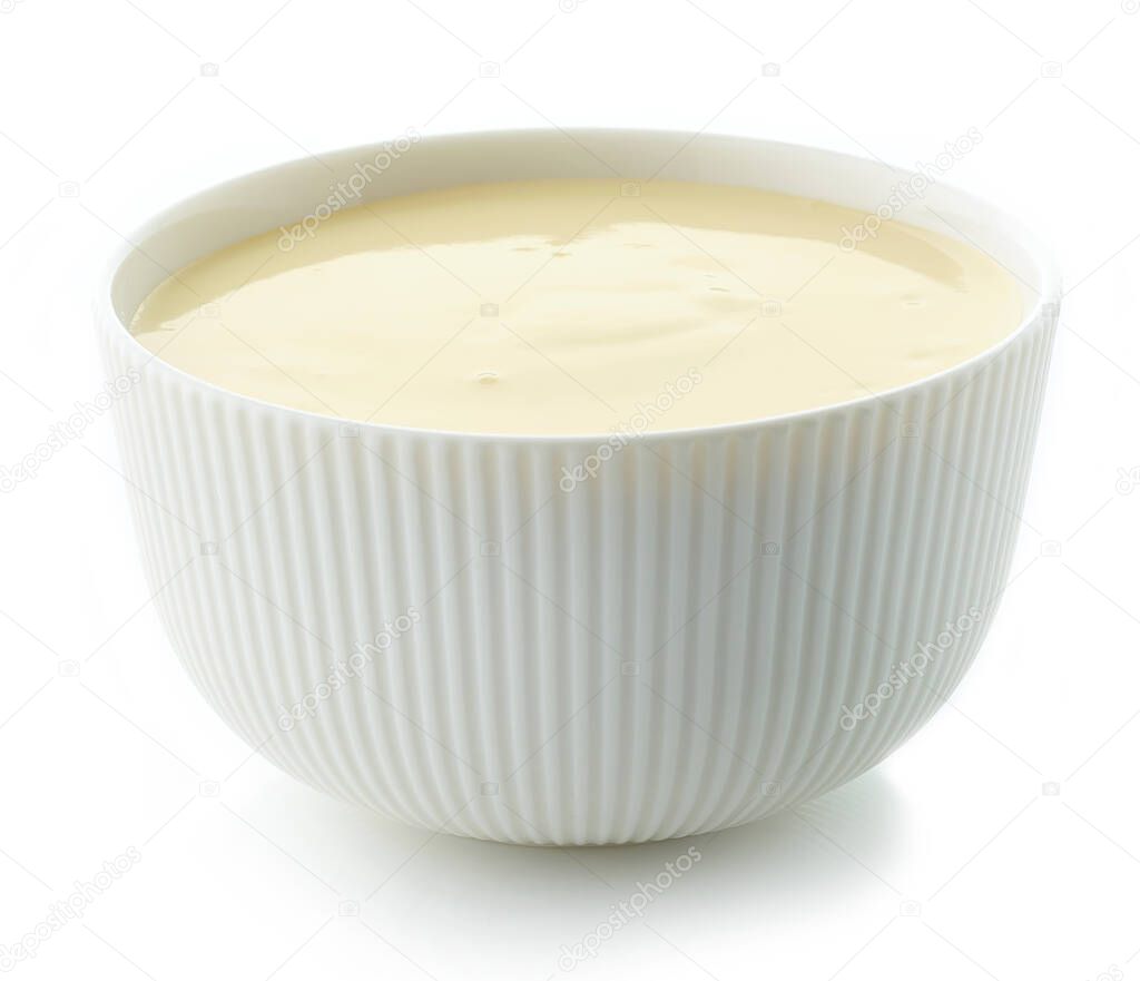 bowl of yellow fruit yogurt isolated on white background