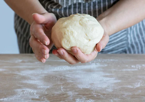 yeast dough and human arms, selective focus