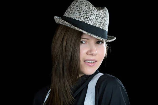 Girl with braces and  man's hat on a black background — Stock Photo, Image