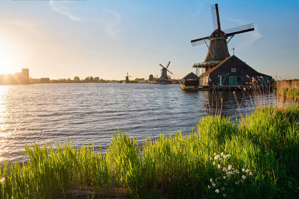Windmills at Zaanse Schans in Holland on sunset. Zaandam, Nether