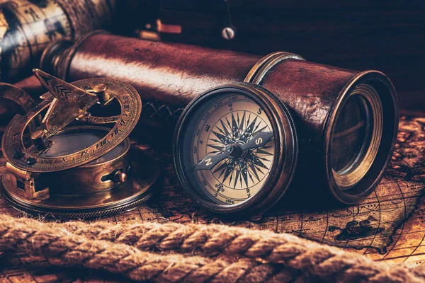 Old vintage compass on ancient map — Stock Photo, Image