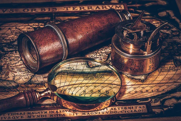 Old vintage compass on ancient map — Stock Photo, Image