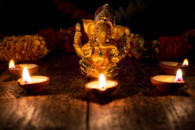 Ganesha with Diwali lights clipart