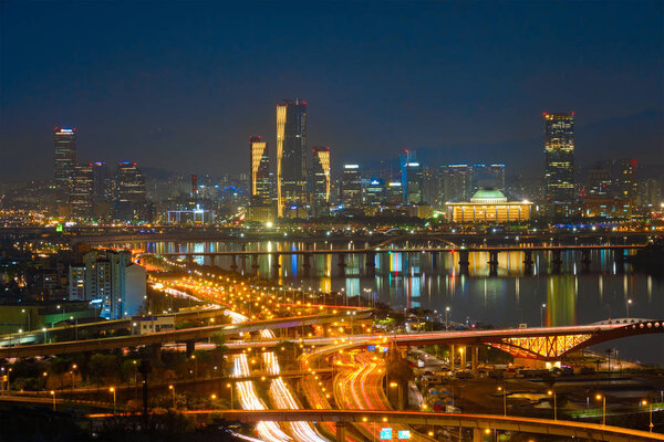 Aerial view of Seoul downtown cityscape and Seongsan bridge over Han River in twilight. Seoul, South Korea.