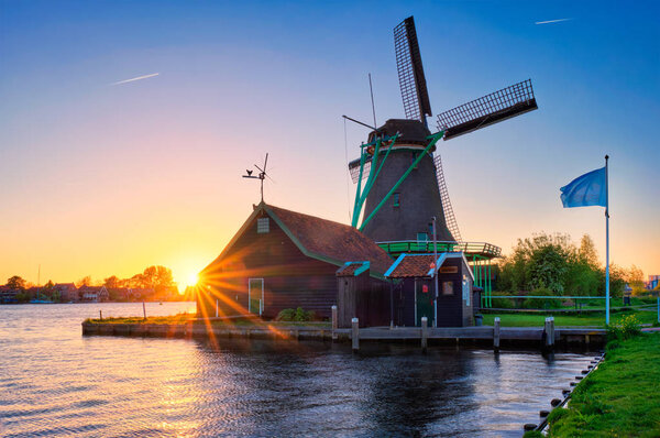 Windmills at Zaanse Schans in Holland on sunset. Zaandam, Netherlands