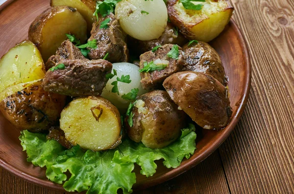 Carne de vinha d\'alhos -  Portuguese dish,  from the Portuguese islands of Madeira and the Azores, Garlic Wine Marinated Pork