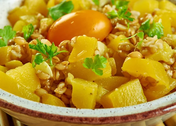 Farro Salad with Butternut andl yellow tomato close up