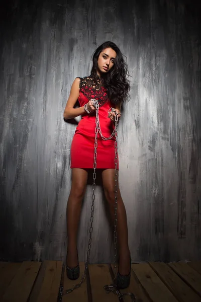 Fashionable Curly Brunette Red Short Dress Posing Chains Front Brick — Stock Photo, Image