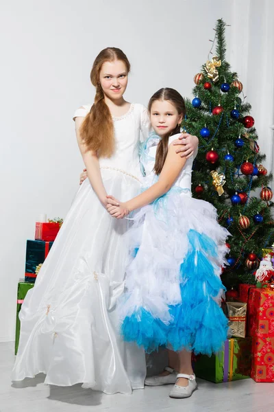 Sisters Festive Dresses Posing Christmas Tree Studio — Stock Photo, Image