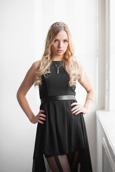 Portrait of lovely young woman posing at camera  