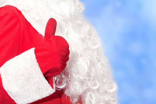 Santa Claus Hand Visar Tummen Upp Blå Frostig Bakgrund — Stockfoto