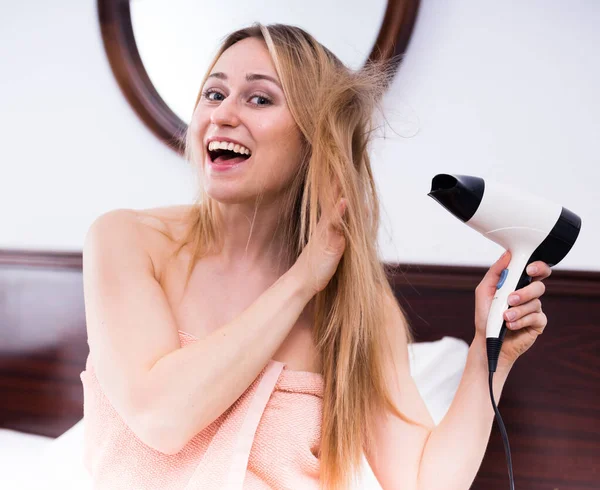 Woman hairdryer in room — Stock Photo, Image