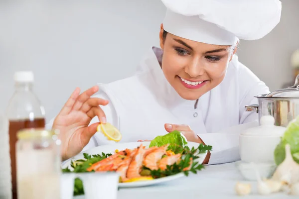 Young Positive Smiling Chef Arranging Shrimps Plate Kitchen — Stock Photo, Image