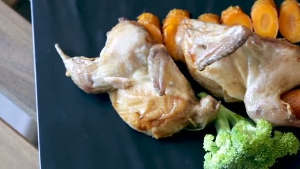 Fried on a grill tasty quail of teriyaki, served with carrots — Stock Video