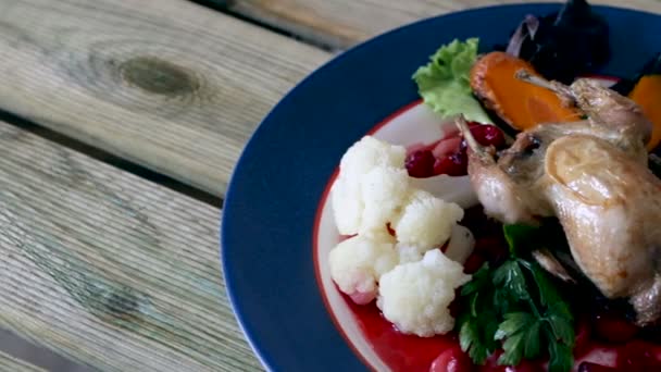 Roasted quail with cranberry sauce — Stock Video