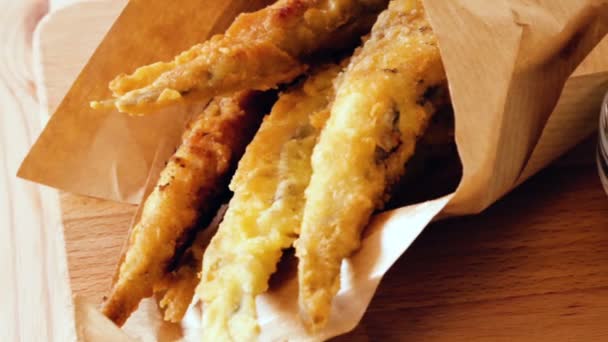 Battered sprats with classic creamy and cheese sauce — Stock Video