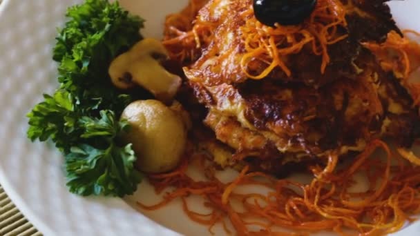 Close up of tasty fried carrot pancakes — Stock Video