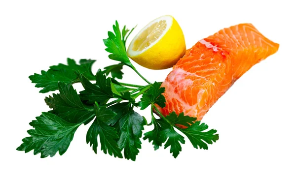 Appetizing raw salmon fillet with lemon and greens — Stock Photo, Image