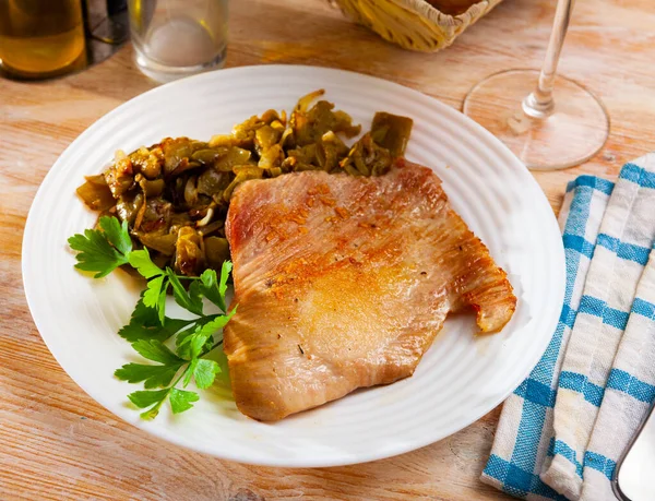 Tasty fried pork chops with stewed beans served — Stock Photo, Image