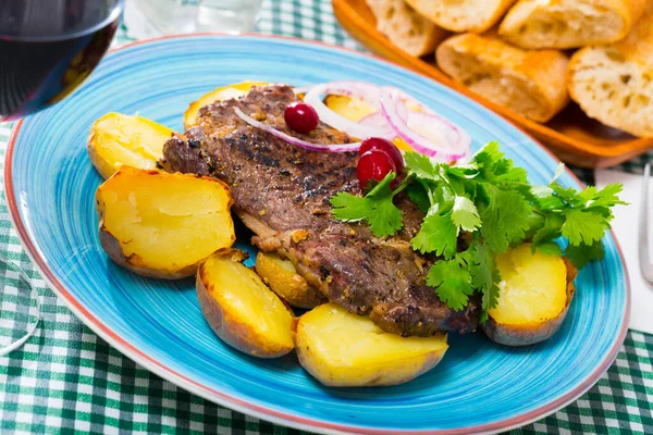 Juicy beefsteak served with baked potato Stock Picture