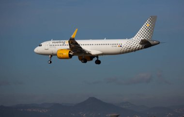 Vueling airliner EC-NAE landing in El Prat Airport in Barcelona clipart