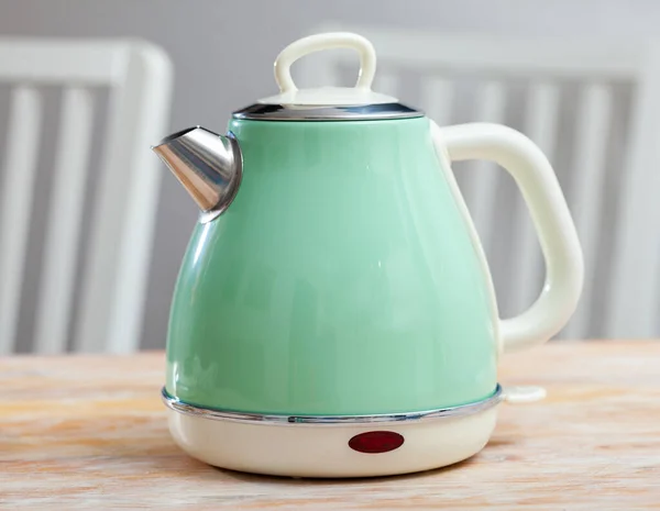 Image of new teapot on table in home interior — Stock Photo, Image