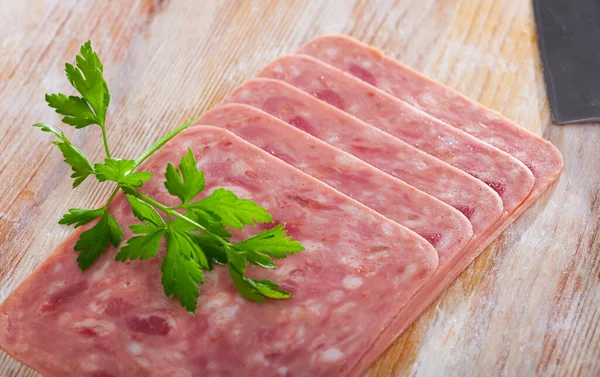 Sliced ham on wooden background — Stock Photo, Image