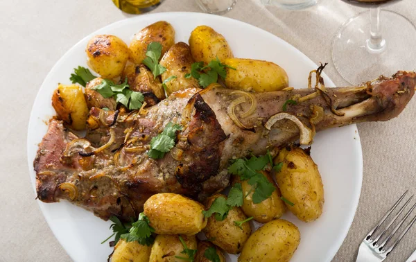 Lamb leg served with potatoes — Stock Photo, Image