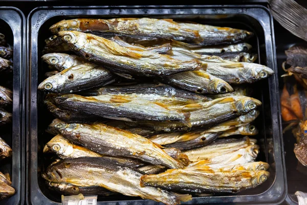 Cured herring and other fish in supermarket — Stock Photo, Image