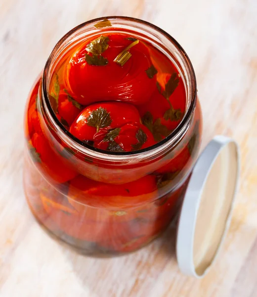 Pickled tomatoes in glass jar — Stock Photo, Image
