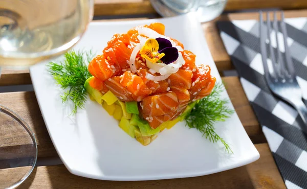 stock image Raw salmon tartare with avocado