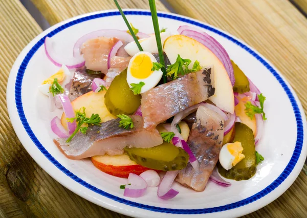 Herring with apples, pickles, onion