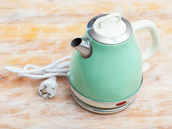 Image of new teapot on table in home interior — Stock Photo, Image
