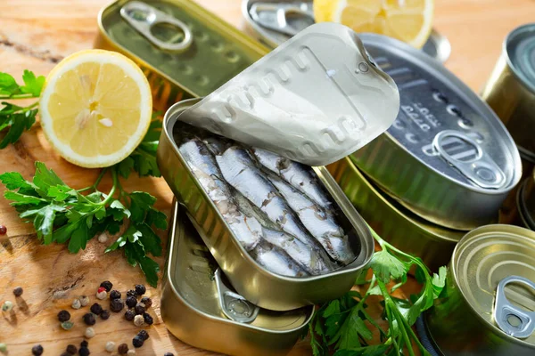 Preserved sardines in oil with herbs and lemon — Stock Image Preserved sardines in oil with herbs and lemon Royalty Free Stock Images