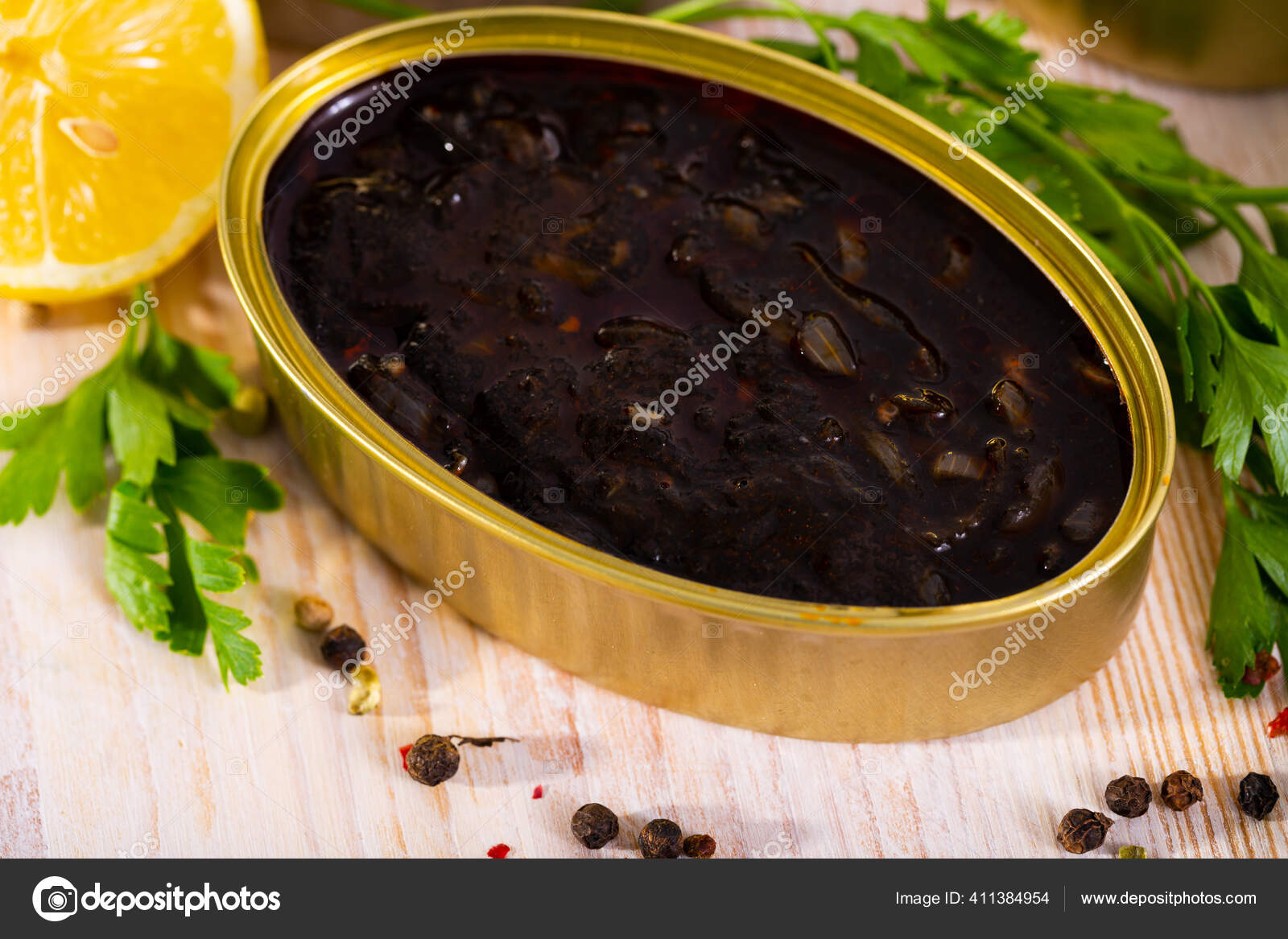 Canned seafood, chopped squid in ink Stock Photo by ©Jim_Filim 411384954