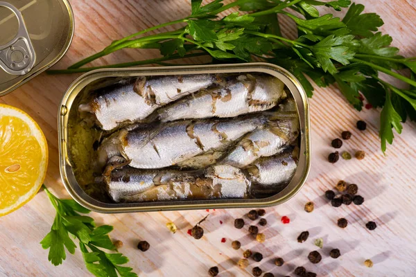 Pilchards in oil with greens and lemon — Stock Image Pilchards in oil with greens and lemon Stock Image