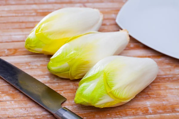 Image of fresh raw endive on the wooden table — Stock Photo, Image