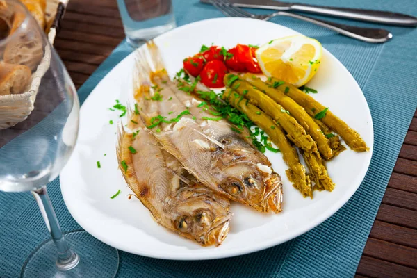 Oven baked rooster fish with marinated asparagus — Stock Photo, Image