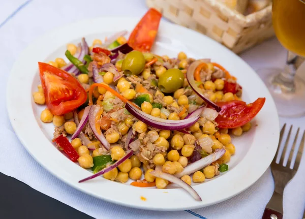 Spanish cuisine - salad with garbanzos and olives — Stock Photo, Image