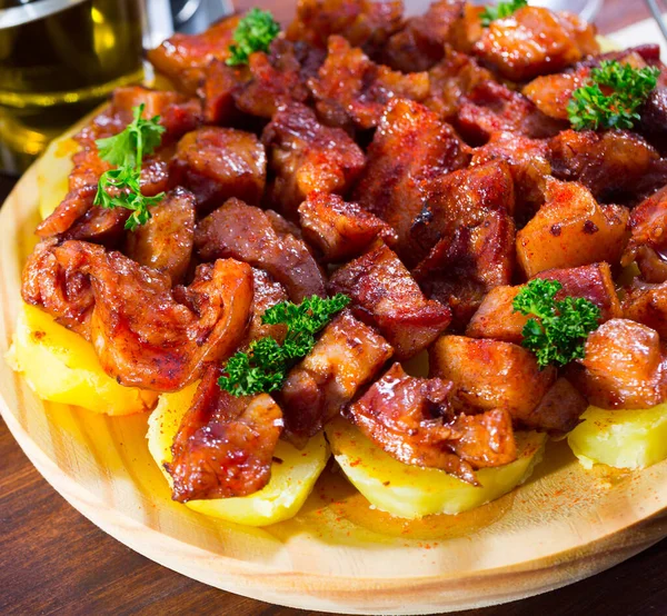 Spanish dish - roasted pig nose and cheeks — Stock Photo, Image