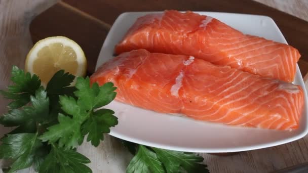 Raw seafood, fresh fillet salmon fish on wooden board — Stock Video