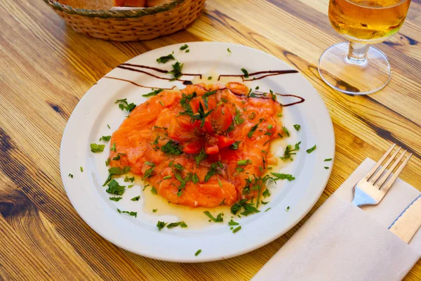 Image of salmon carpaccio served with greens on plate — Stock Photo, Image