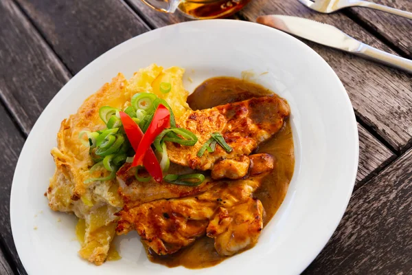 stock image Sliced chicken with baked potatoes. 