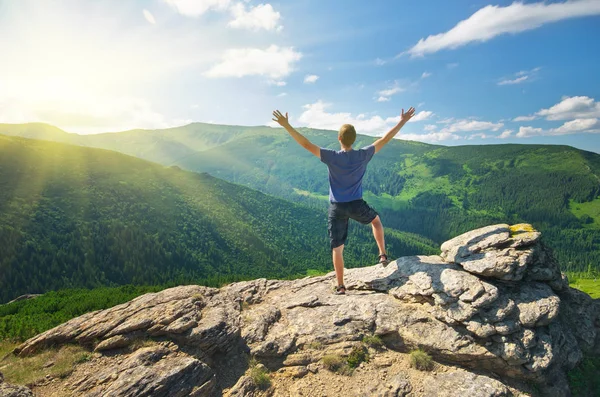 Man on peak of mountain. Royalty Free Stock Photos