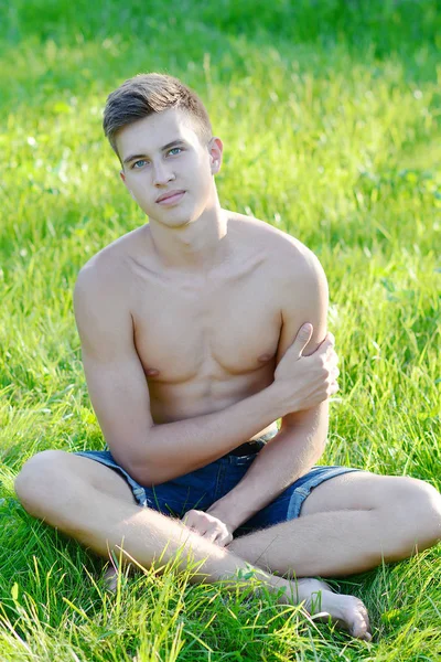 Shirtless fit male on the grass — Stock Photo, Image