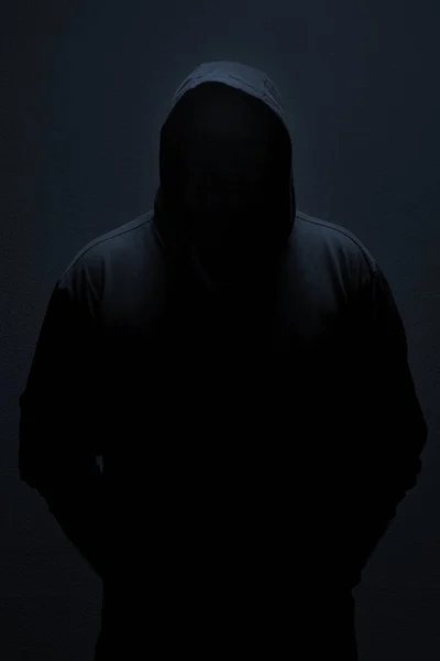 Male silhouette in casual sportswear with hood Stock Photo