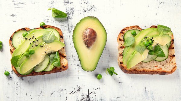 Avocado toasts, healthy vegetarian and diet concept