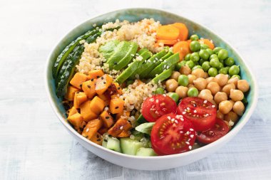 Vegan buddha bowl. Healthy  and balanced food concept clipart